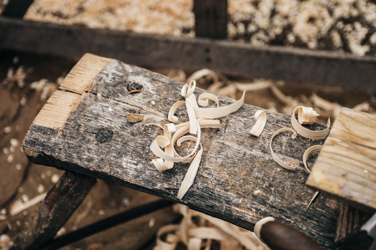 Mastering the First Impression: Your intriguing post title goes here Rustic workbench covered in wood shavings, showcasing detailed craftsmanship.